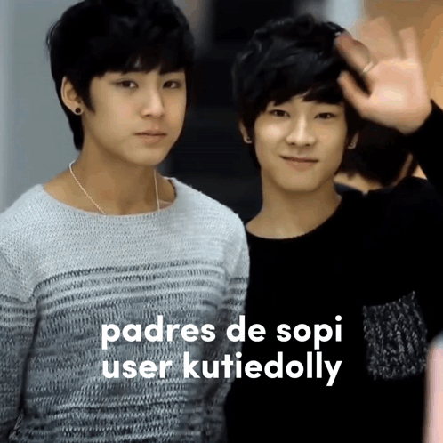 Two Young Boys Are Standing Next To Each Other And The Words Padres De Sopi User Kutiedolly Are Visible GIF
