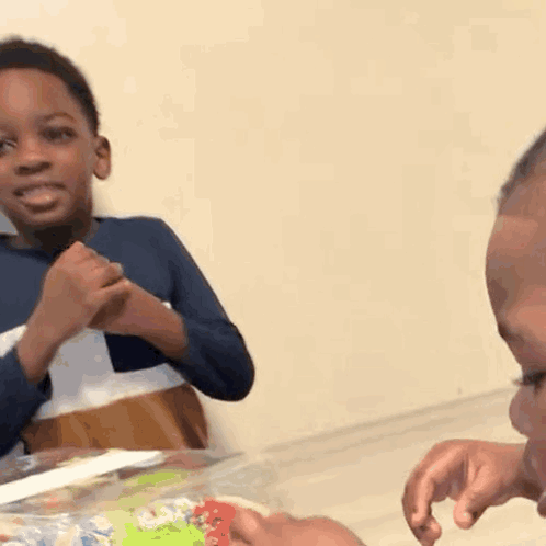 Two Young Boys Crying and Laughing