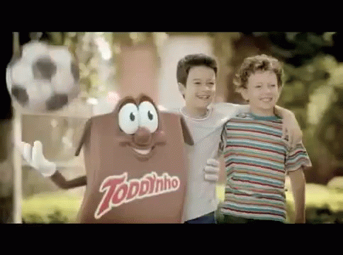 Two Young Boys Next to Toddynho Candy