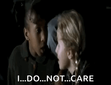 Two Young Girls Are Talking To Each Other In A Dark Room And One Girl Is Saying `` I ... Do ... Not ... Care '' . GIF