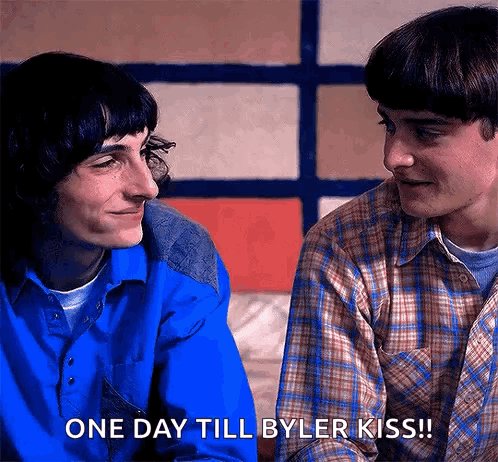 Two Young Men Are Looking At Each Other And One Of Them Is Saying One Day Till Byler Kiss . GIF