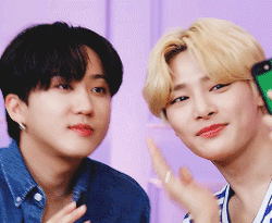 Two Young Men Are Posing For A Picture And One Is Holding A Cell Phone GIF