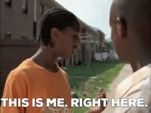 Two Young Men Are Standing Next To Each Other And One Of Them Is Saying This Is Me . Right Here . GIF