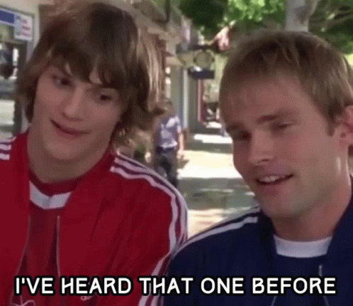 Two Young Men Are Standing Next To Each Other On A Sidewalk And One Of Them Is Saying I 'Ve Heard That One Before GIF