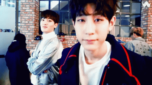 Two Young Men by Brick Wall with Letter W