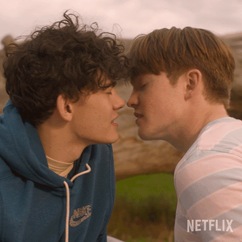 Two Young Men Kissing With A Netflix Logo In The Corner GIF
