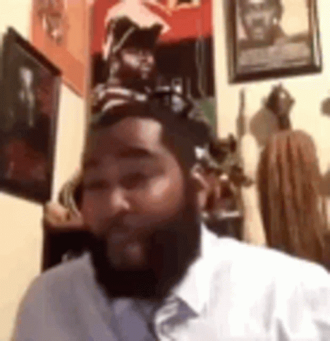 Two Young Men On Couch One Talking On Phone GIF