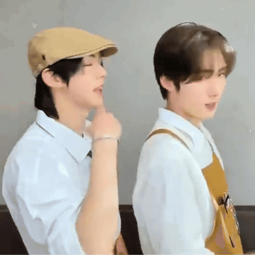Two Young Men, One in Hat, One in Apron