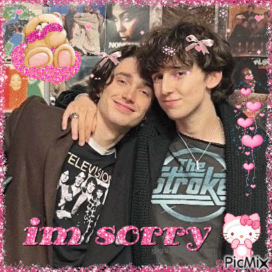 Two Young Men Posing For A Picture With The Words Im Sorry Written In Pink GIF