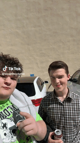 Two Young Men Posing for Photo