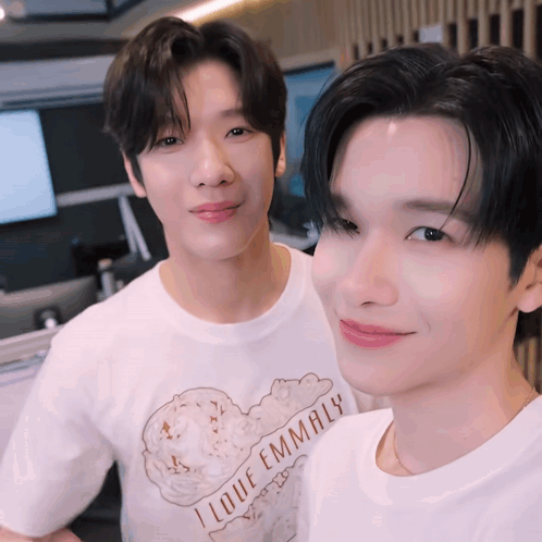 Two Young Men Posing for Picture One Wearing I Love Emmaly T-Shirt