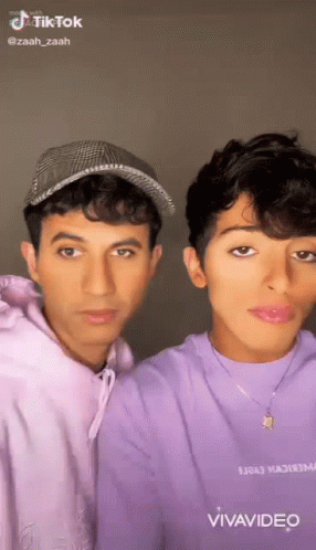Two Young Men Posing Together