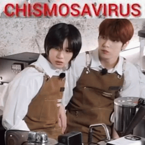 Two Young Men Sitting In Kitchen GIF