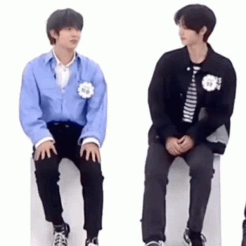 Two Young Men Sitting On White Box GIF