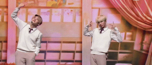 Two Young Men Standing On Stage GIF