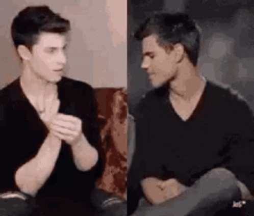 Two Young Men Talking on Couch