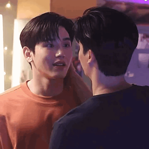 Two Young Men Touching Foreheads