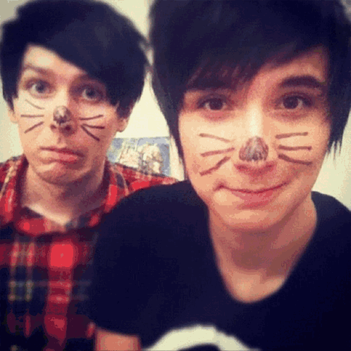 Two Young Men With Cat Face Paint