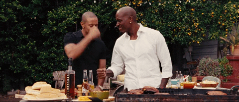 Tyrese Gibson And Ludacris Fist Bump While Cooking GIF