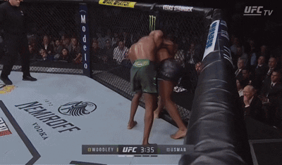 Ufc Tv Shows A Boxing Match Between Woodley And Husman At 3:35 GIF