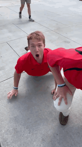 Uga Bulldogs Fans Crawling On Sidewalk GIF