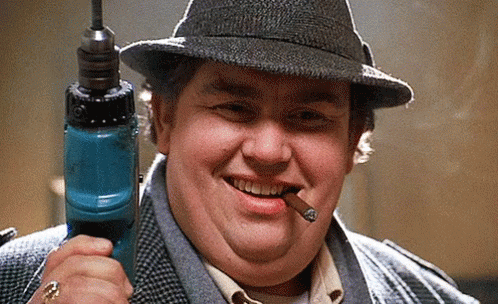 Uncle Buck Holding Screw Driver GIF