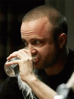 Uncomfortable Looks While Drinking Of Jesse Pinkman GIF