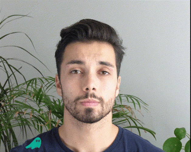 Uncomfortable And Awkward Smile Of An Indian Man GIF