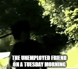 Unemployed Friend Standing in Front of Tree