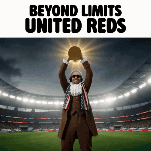 United Reds Man Holding Trophy Above Head