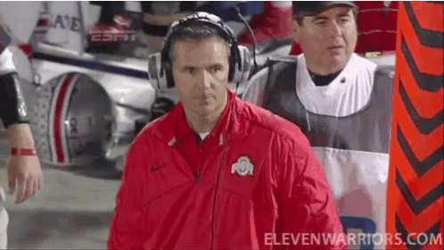 Urban Meyer Bow Holding Knees GIF