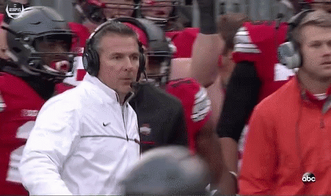 Urban Meyer Lying In The Field GIF