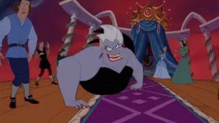 Ursula From The Little Mermaid Is Sitting On A Purple Carpet In Front Of A Crowd Of People . GIF