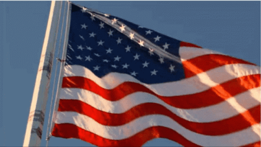 Usa Flag Waving Against Blue Sky GIF