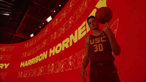 Usc Gesturing Peace Sign While Spinning Ball On Finger GIF