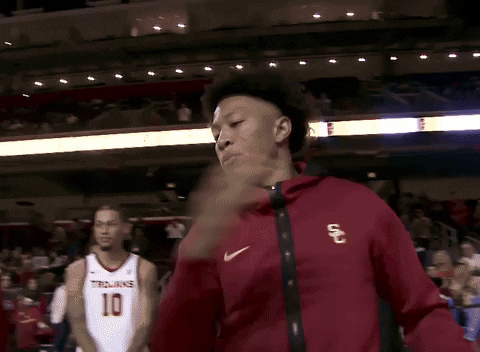 Usc Player Doing Hand Shake With Teammate GIF