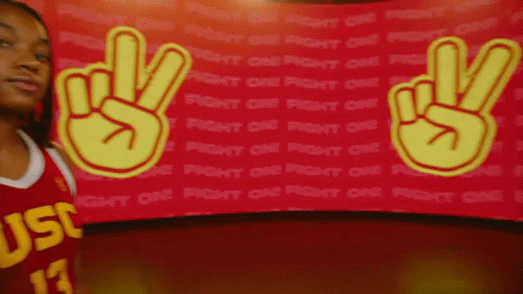 Usc Woman Player Gesturing Peace Sign With Peace Background GIF