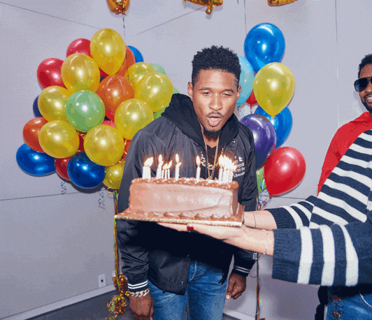 Usher Blowing Birthday Candles On Cake GIF