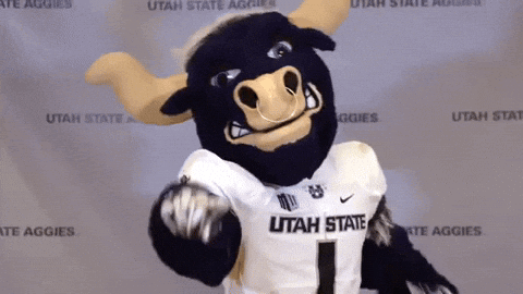 Utah State Aggies Mascot in Front of Wall