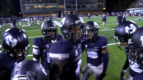 Utah State Football Players Huddle