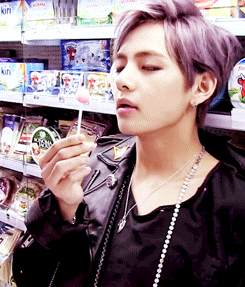 V Licking His Lollipop Slowly GIF