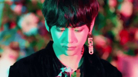 V Smelling A Flower GIF