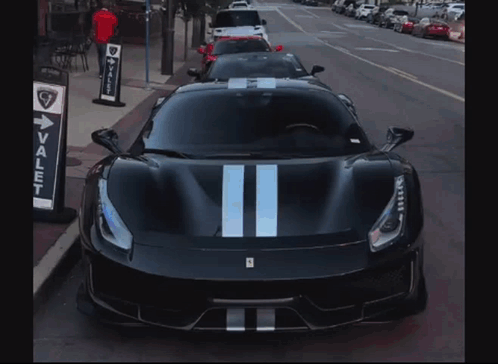 Valet Sign Next to Black Sports Car