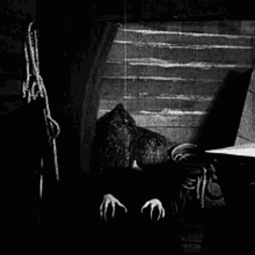 Vampire With Claws In Dark Room GIF