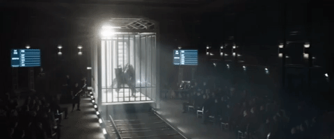 Velociraptor Locked In Cage Around People GIF