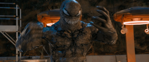 Venom Statue Arms Crossed Mouth Open GIF