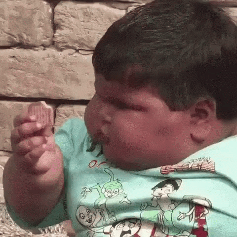Very Fat Boy Eating Bread