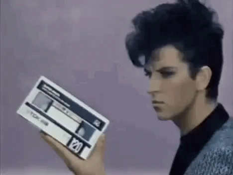 Steve Strange Holding A Vhs Tape Loop GIF