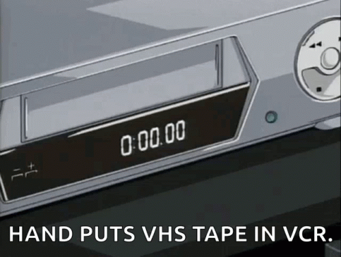 Vhs Tape Putting In Vcr Player GIF