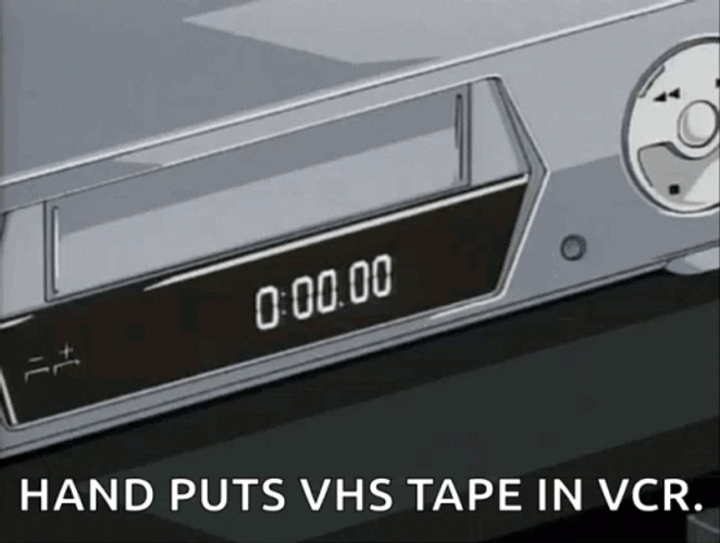 Vhs Tape Putting In VCR Player GIF